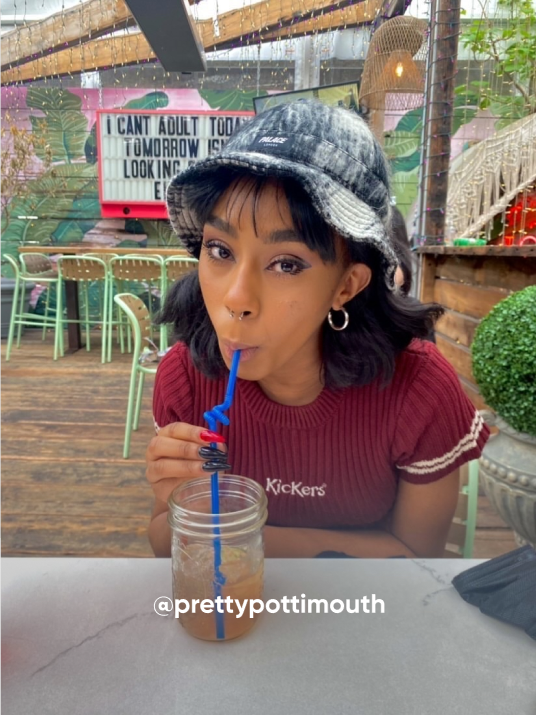 woman sipping a drink outside - Visit Kickers Instagram