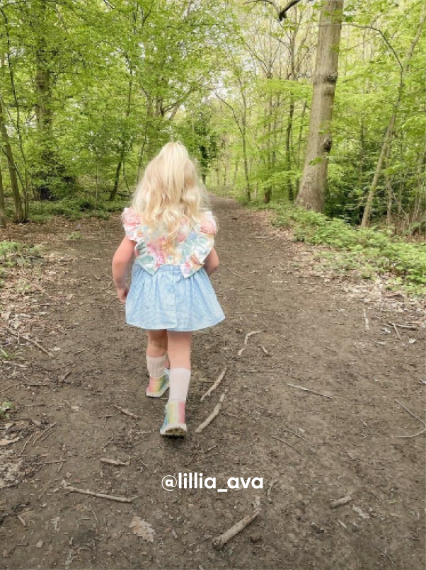 Girl Walking in the Grass - Visit Kickers Kids Instagram