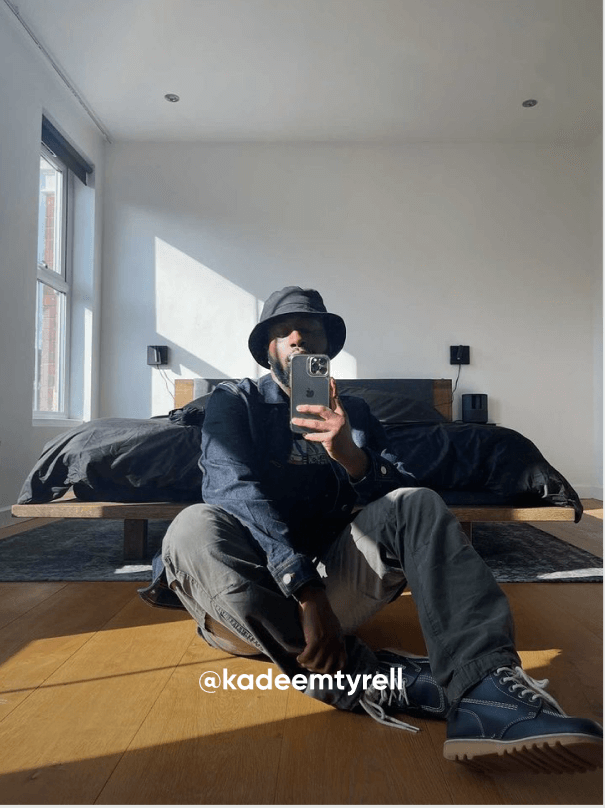man sat down taking a photo - Visit Kickers Instagram