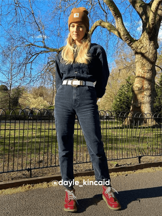 woman posting outside on the street - Visit Kickers Instagram