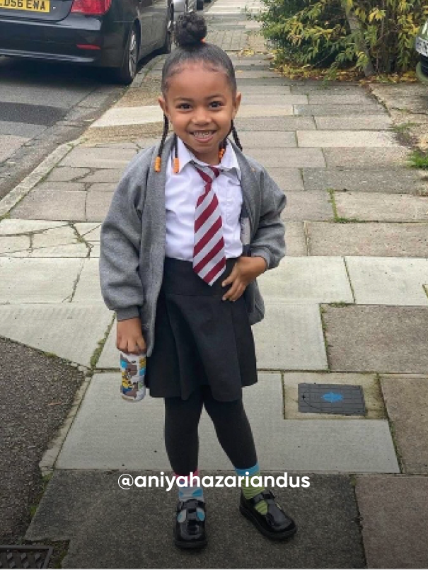 girl smiling on the street - Visit Kickers Kids Instagram